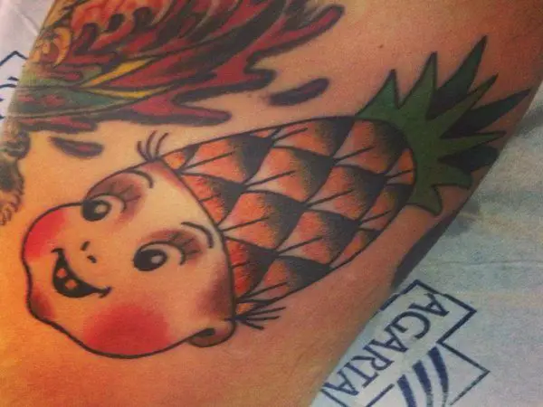 Baby Doll with Rosey Cheeks and Pineapple Hat Tattoo