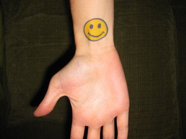 Happy Yellow Face Inner Wrist Tattoo