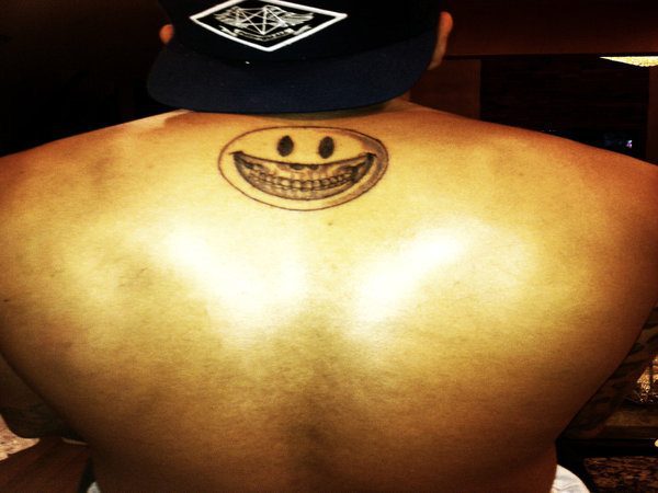 Back of the Neck Smiley Face Outline Tattoo