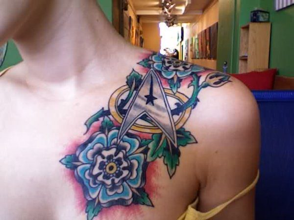 Shoulder Tattoo of Star Trek Insignia with Bright Blue Flowers