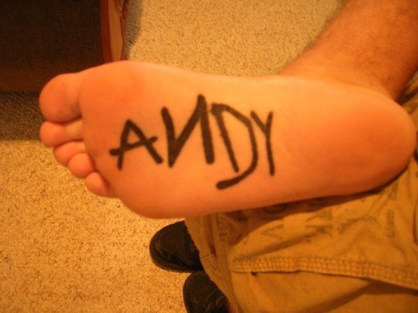 Bottom of the Foot Andy Word Tattoo