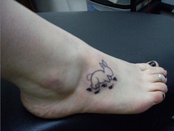 Small Rabbit Outline Tattoo with Bunny Tracks