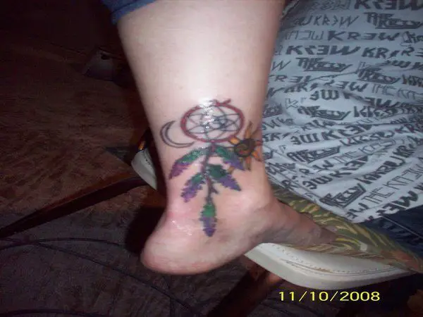 Dream Catcher Ankle Tattoo with Purple Flowers
