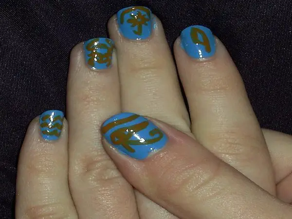 Light Blue Nails with Gold Egyptian Symbols
