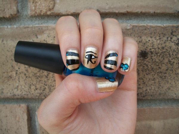 Gold Nails with Egyptian Scarabs, Eye of Horus, and Black Stripes with Blue Dots