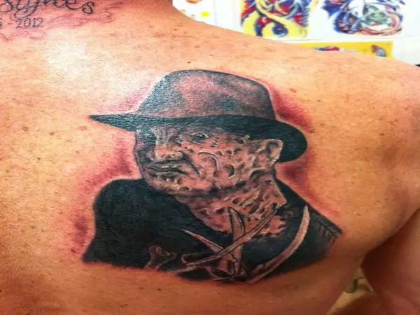 Black Ink Back of Shoulder Freddy Tattoo