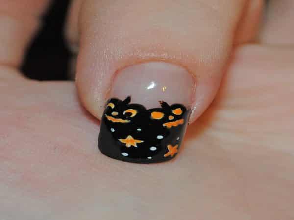 Plain Nails with Black Tips Decorated with Pumpkins, Stars, and Dots
