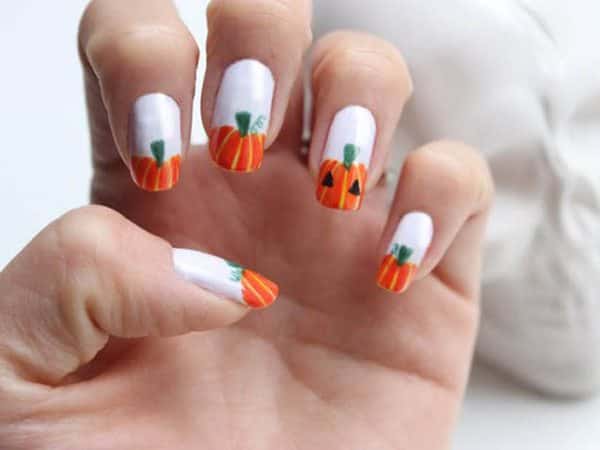 White Nails with Striped Orange Carved Pumpkin Tips