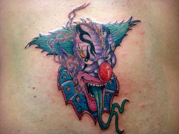 Brightly Colored Scary Clown Tattoo with Long Green Tongue