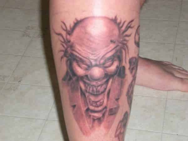 Screaming Evil Clown Leg Tattoo