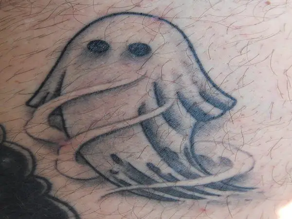Ghost In White Sheet Arm Tattoo