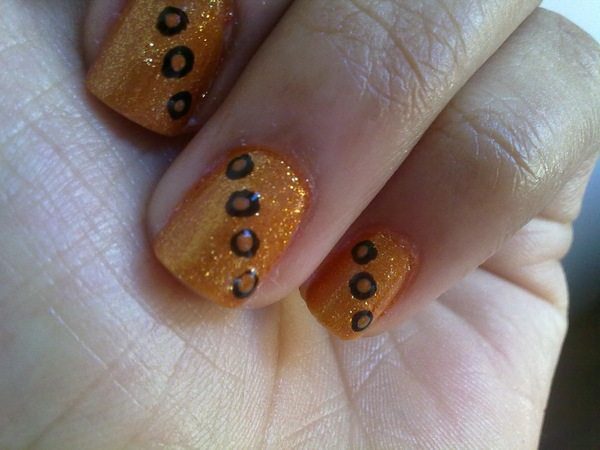 Orange Glitter Nails with Brown and Black Dots