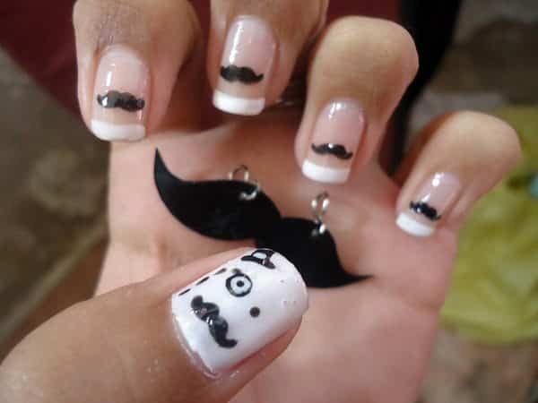 French Manicured Nails with Mustaches and One White Nail with a Face and Hat