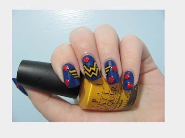 Blue Nails with the Yellow Wonder Woman Symbol and Red Stars