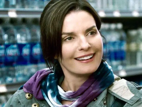 Sela Ward Dark Straight Hair In a Bun