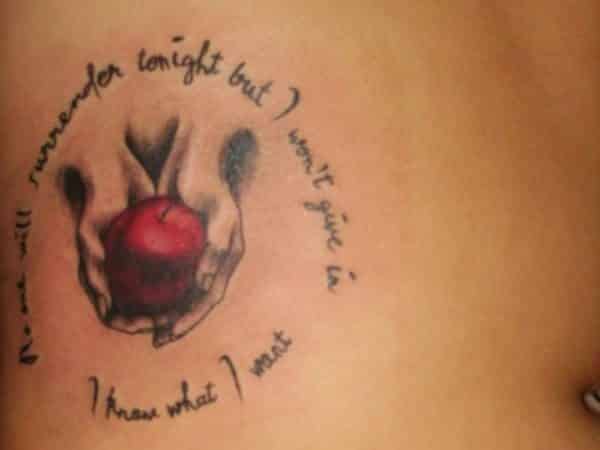 Apple with Hands and Circle of Words Tattoo