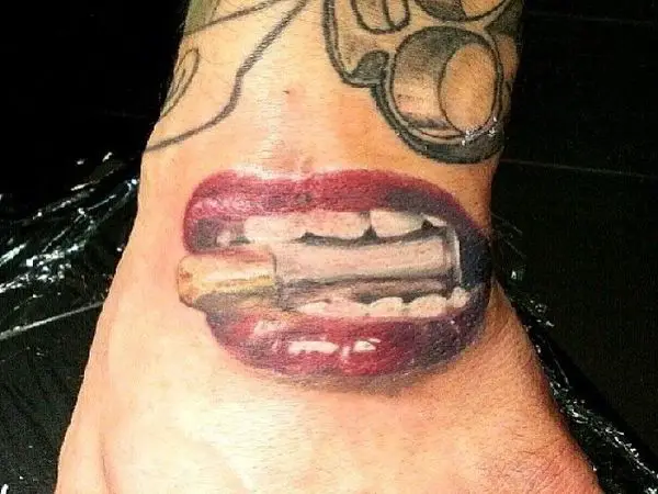 Bite the Bullet with Red Lips Tattoo