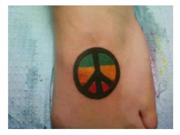 Red, Green, and Yellow Peace Sign Tattoo