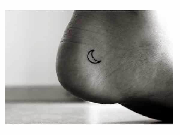 Tiny Crescent Moon Heel Tattoo