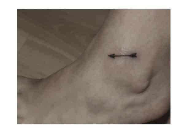 Tiny Arrow Tattoo On Ankle