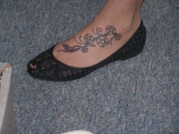 Many Pentagrams Foot Tattoo with Feathers