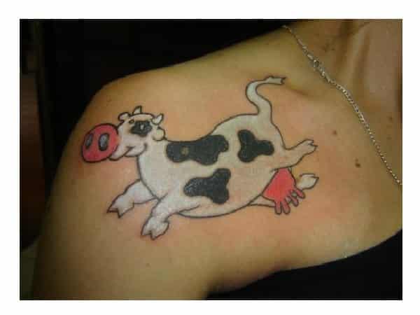 Happy Jumping Cartoon Cow Tattoo