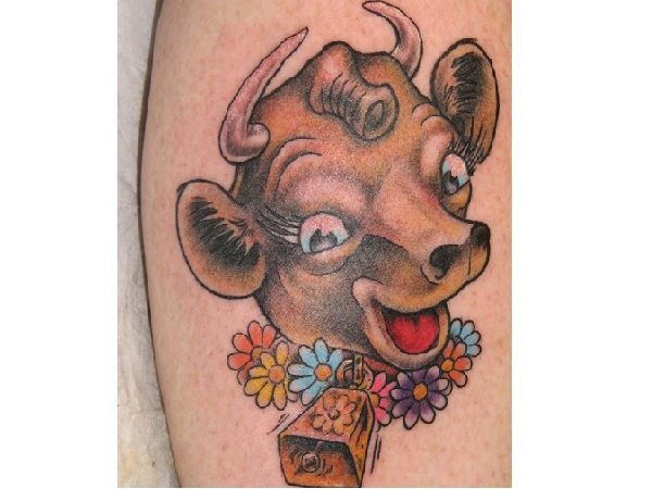 Elsie the Cow Cartoon Tattoo with Flowers