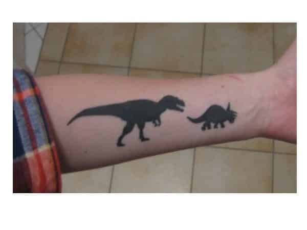 Dinosaur Chasing Dinosaur Shadow Arm Tattoo