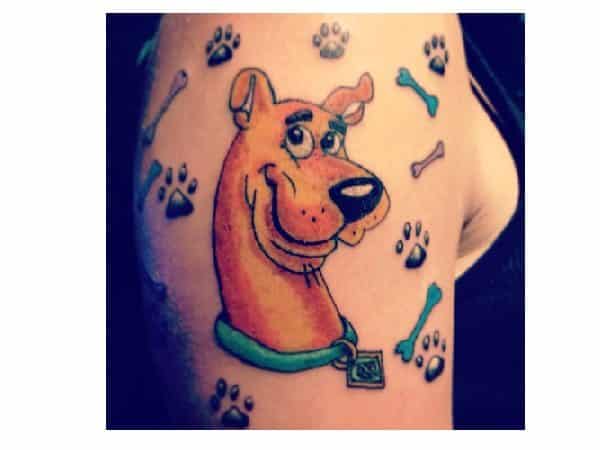 Scooby Doo Head Tattoo with Bones and Paw Prints Tattoo