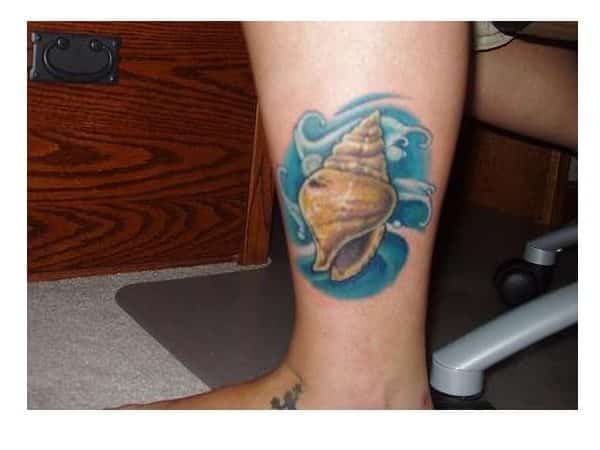 Conch Seashell Leg Tattoo with Blue Waves