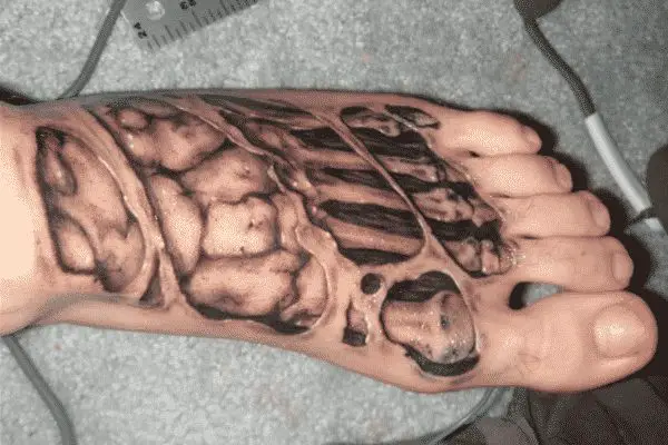 Biomechanical Ripped Skin Tattoo Design