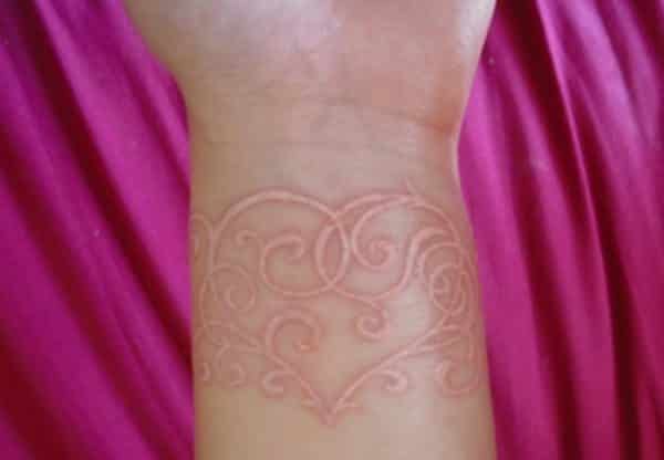 white ink wrist tattoo 11