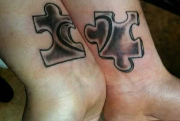 Minimalistic style matching puzzle piece tattooed on