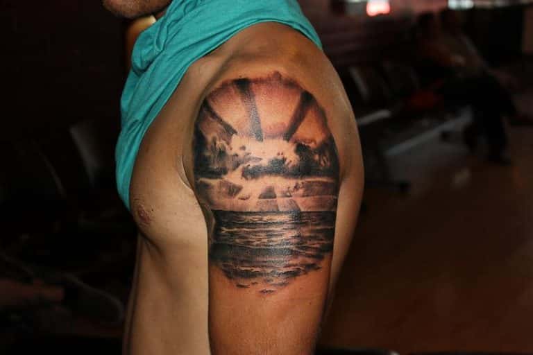 14 Beautifully Done Ocean Sunset Tattoos