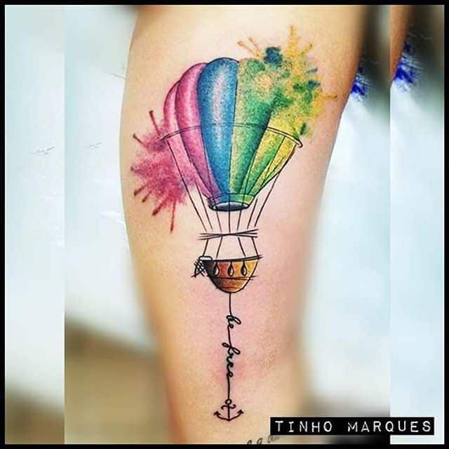 Hot air balloon tattoo located on the tricep