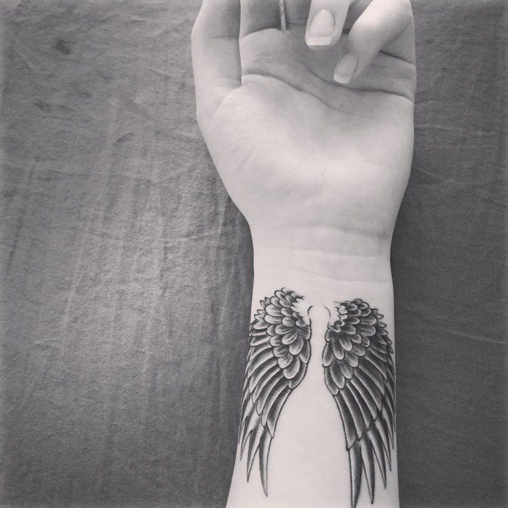 Angel hand tattoos for women