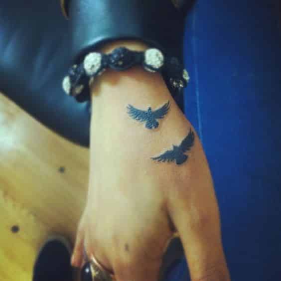 Bird Silhouette hand tattoos for women