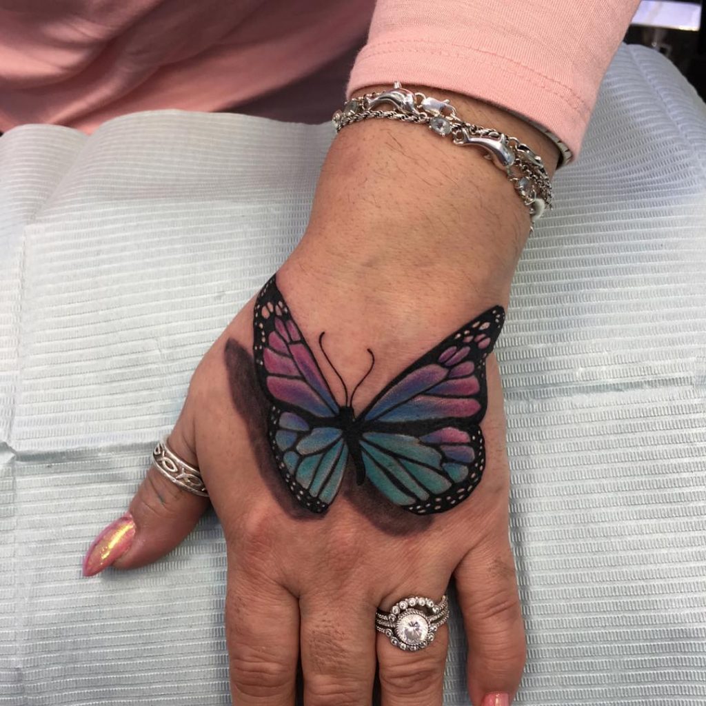 Butterfly effect hand tattoo for women