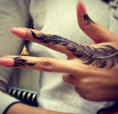 Feather hand tattoos for women