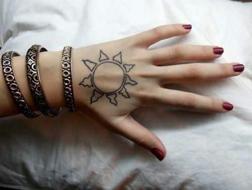 Minimalistic Sun hand tattoos for women