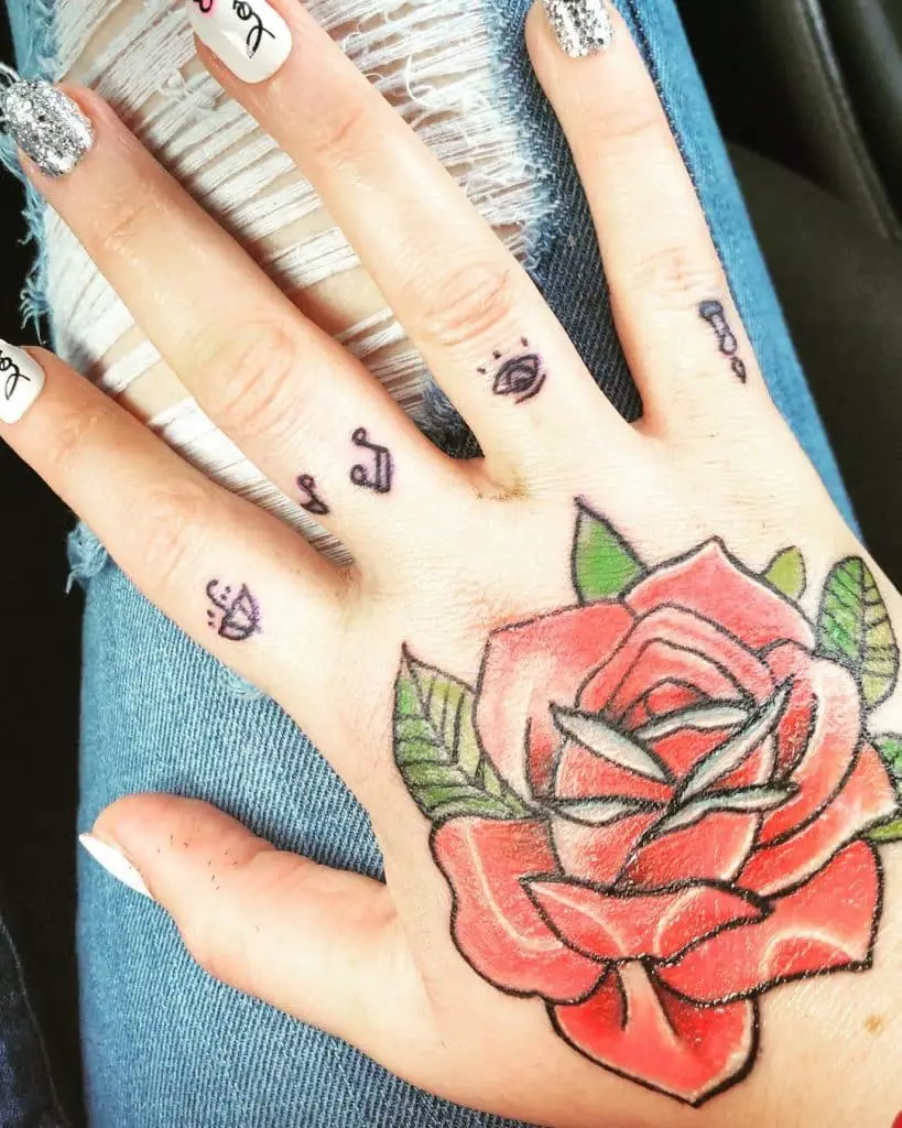 Red Roses and other cute stuff hand tattoos for women