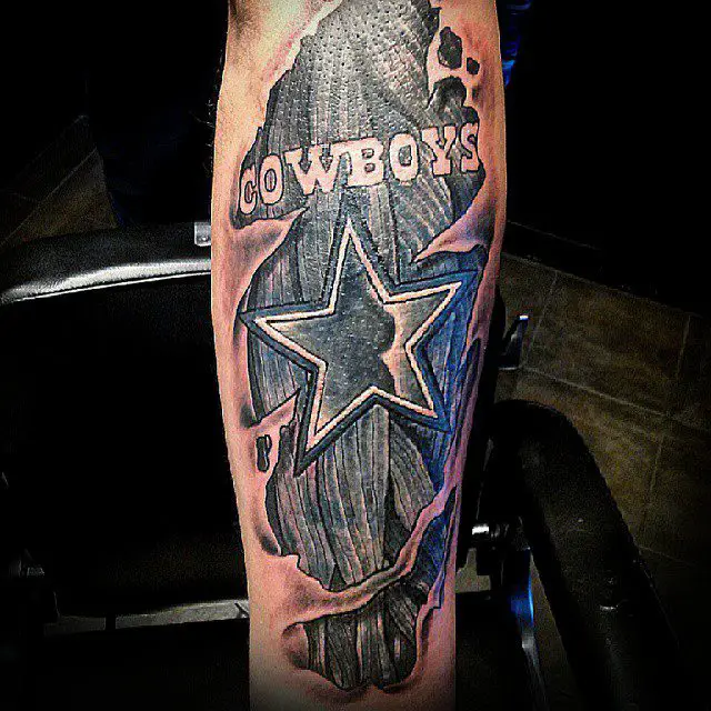 Ripping skin dallas cowboys tattoo