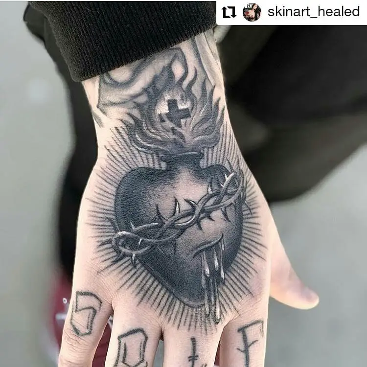 Suffering heart Hand tattoos for women