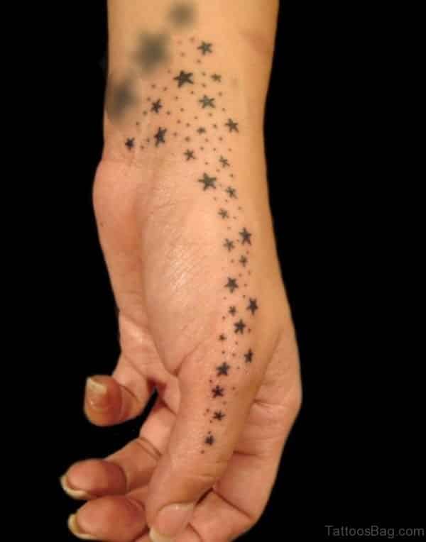Tiny Stars hand tattoos for women