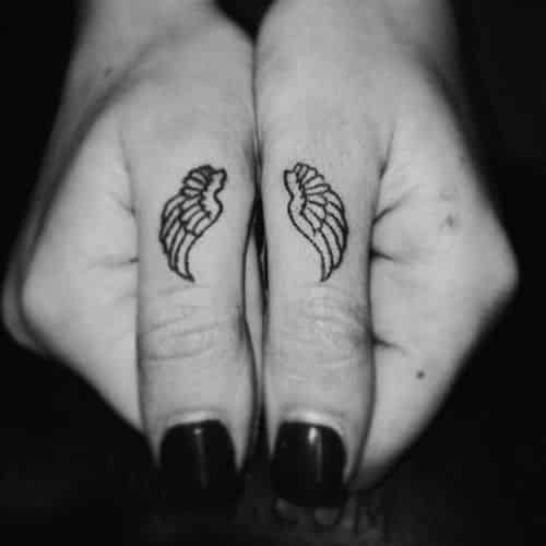 Wings hand tattoos for women