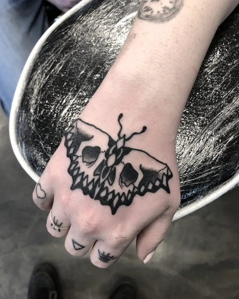 skeleton butterfly Hand tattoos for women