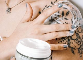 35 Best Lotions for Tattoo Aftercare Soothing & Healing putting lotion on tattoo